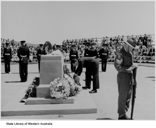 Gordon Reid laying a wreath at Anzac Day ceremony , 1957.